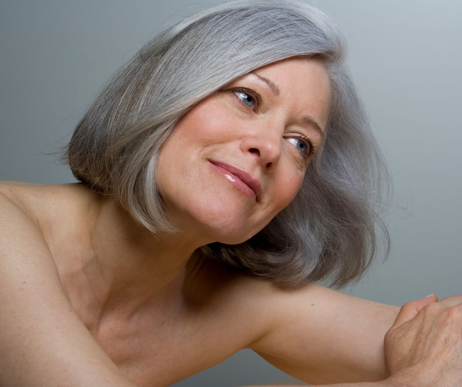 Mature woman with grey hair.