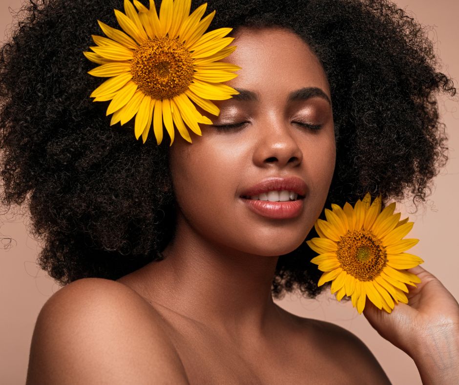 Young woman with sunflowers