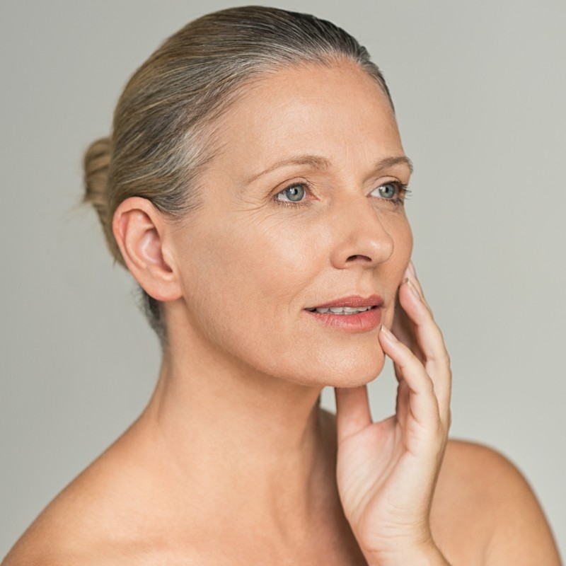 Mature woman with smooth, rejuvenated skin after Botox anti-wrinkle injections